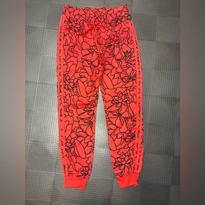 ADIDAS WOMENS PHARRELL WILLIAMS JOGGER PANTS SIZE SMALL RED AND BLACK